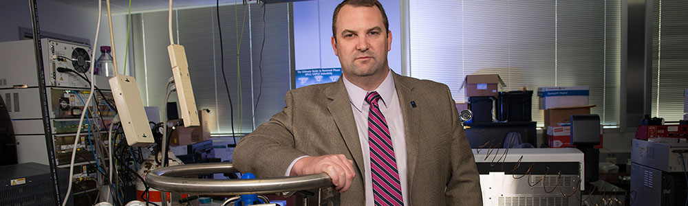 Dr. Kevin Schug standing in a laboratory